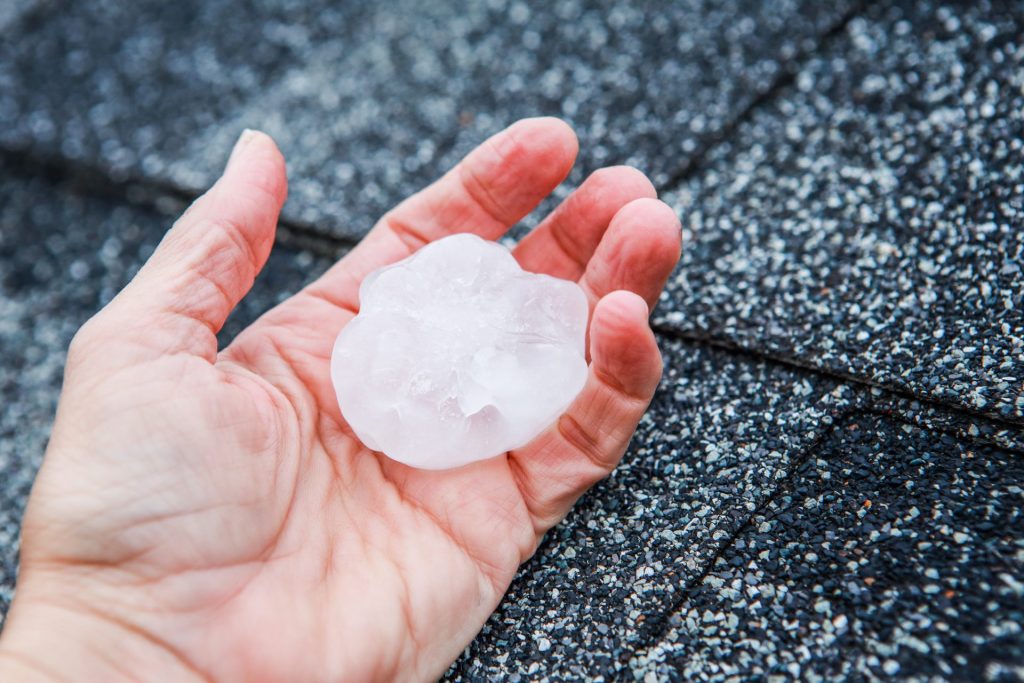 Three Key Signs of Hail Damage on Your Asphalt Shingle Roof